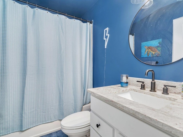 full bathroom with shower / bath combo with shower curtain, toilet, and vanity