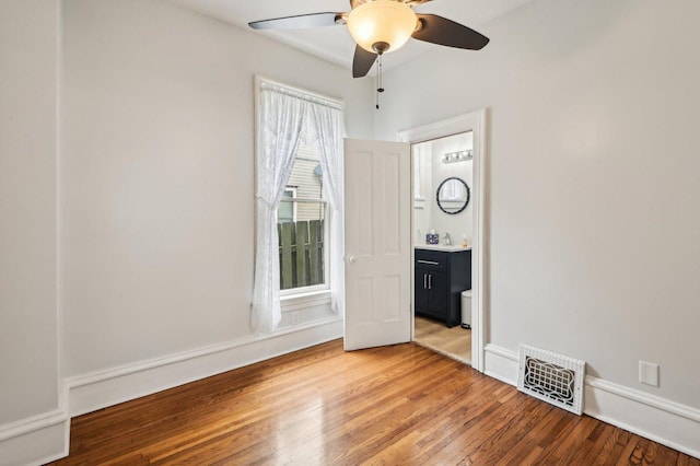 108 N Channing St, Elgin, IL 60120 - unfurnished bedroom featuring light wood-style flooring, a ceiling fan, baseboards, and ensuite bathroom