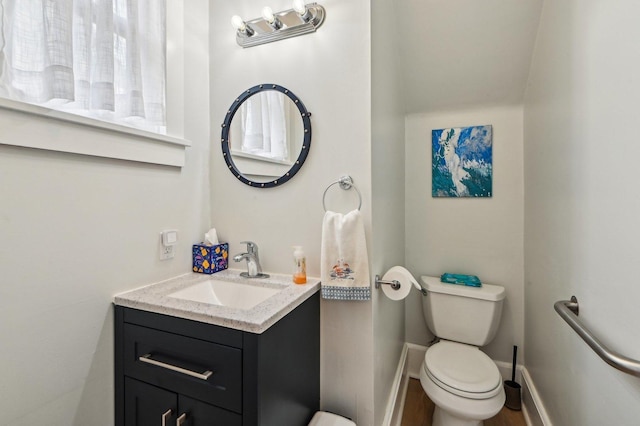 108 N Channing St, Elgin, IL 60120 - bathroom with toilet, vanity, and baseboards