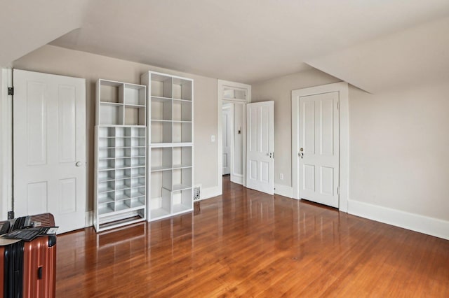 108 N Channing St, Elgin, IL 60120 - unfurnished bedroom with wood finished floors, baseboards, and a closet