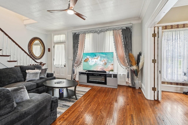 108 N Channing St, Elgin, IL 60120 - living room with a ceiling fan, stairs, hardwood / wood-style floors, crown molding, and baseboards
