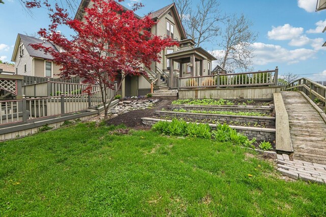108 N Channing St, Elgin, IL 60120 - view of grassy yard with a wooden deck