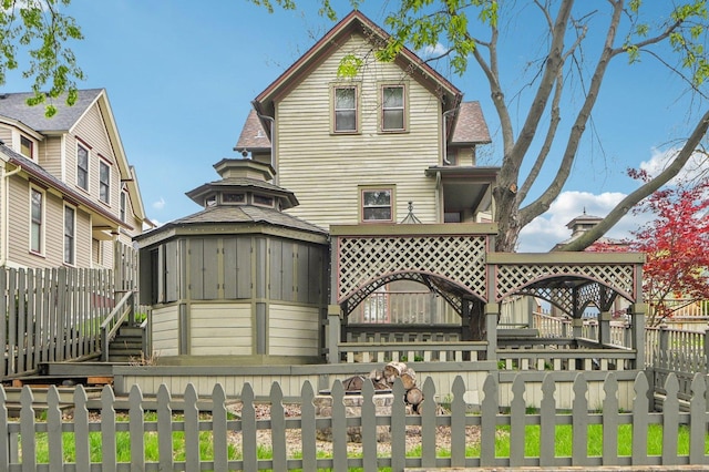 108 N Channing St, Elgin, IL 60120 - rear view of house featuring a fenced front yard and a gazebo