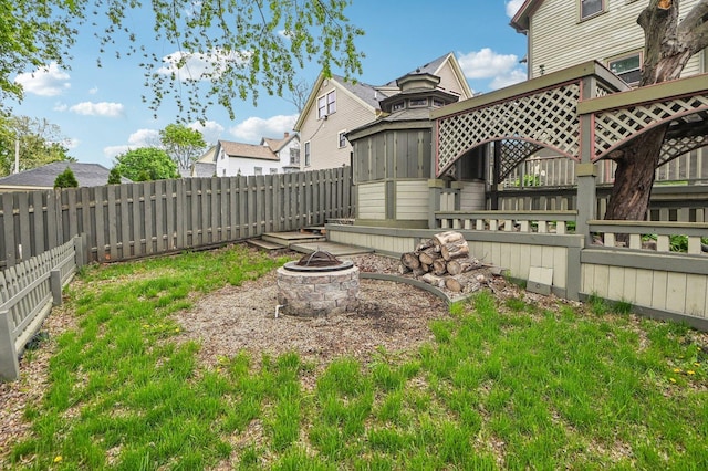 108 N Channing St, Elgin, IL 60120 - fenced backyard featuring a fire pit
