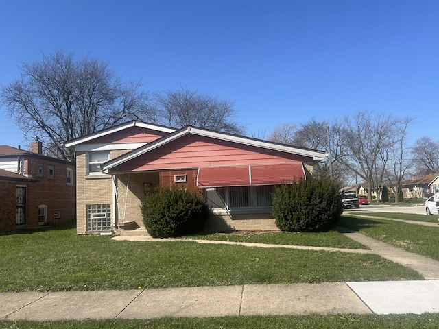 644 E 154th St, Dolton, IL 60419 - view of front of property featuring brick siding and a front lawn