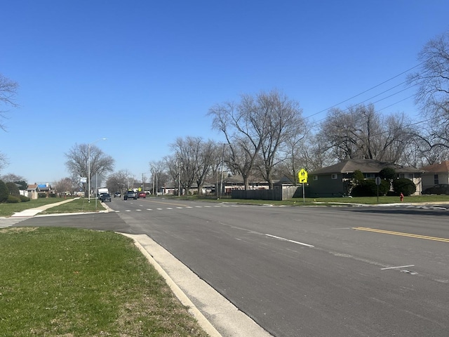 644 E 154th St, Dolton, IL 60419 - view of street with street lighting, curbs, traffic signs, and sidewalks