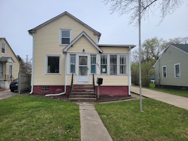 2811 Ezekiel Ave, Zion, IL 60099 - bungalow-style home with a front lawn and entry steps