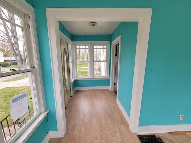 2811 Ezekiel Ave, Zion, IL 60099 - doorway to outside with baseboards, visible vents, light wood-type flooring, and a wealth of natural light