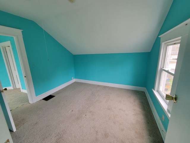 2811 Ezekiel Ave, Zion, IL 60099 - bonus room featuring carpet floors, baseboards, vaulted ceiling, and visible vents