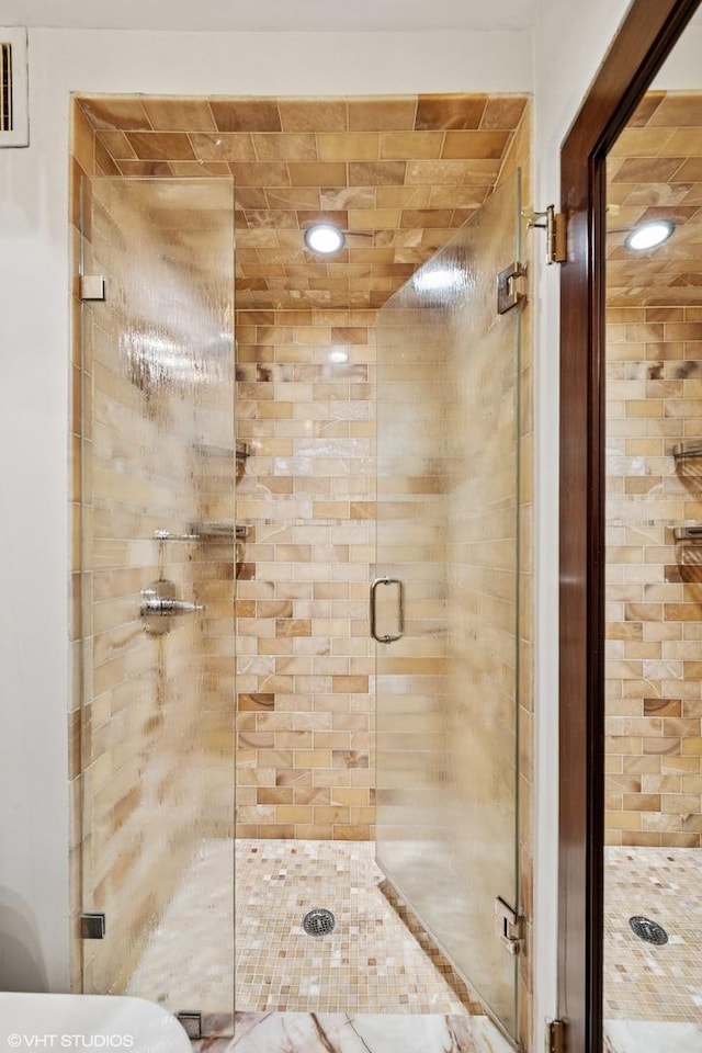 full bathroom featuring a stall shower