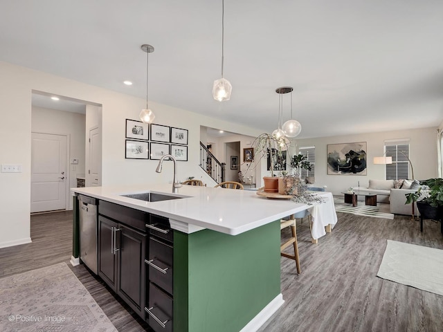 257 Kennedy Dr, Saint Charles, IL 60175 - kitchen with a sink, dishwasher, dark wood-style flooring, light countertops, and open floor plan
