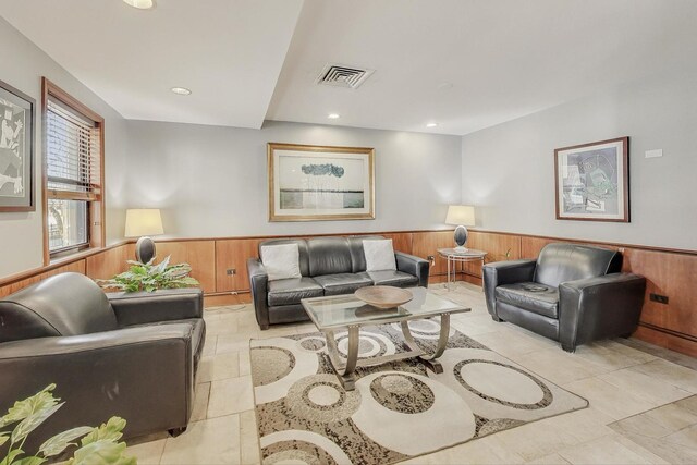6030 N Sheridan Rd Unit 411, Chicago, IL 60660 - living area featuring wood walls, a wainscoted wall, visible vents, and recessed lighting