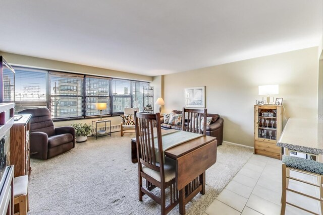 6030 N Sheridan Rd Unit 411, Chicago, IL 60660 - dining room featuring light colored carpet, baseboards, and light tile patterned floors