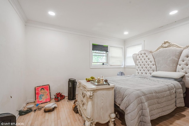 bedroom featuring crown molding, recessed lighting, and hardwood / wood-style floors