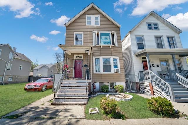 view of front facade featuring covered porch and a front yard