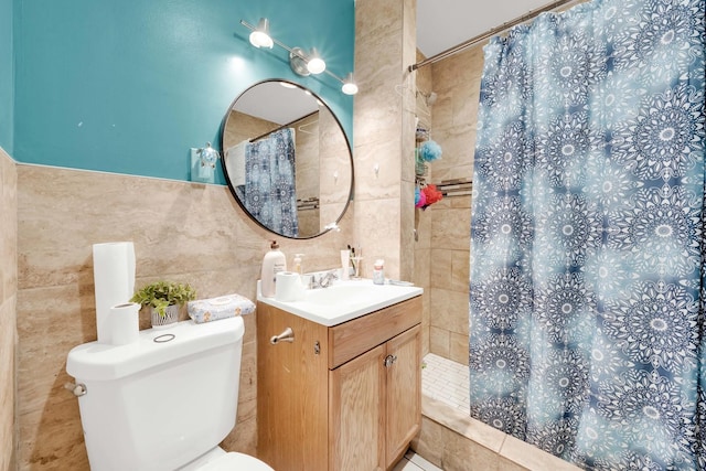 bathroom featuring vanity, tile walls, toilet, and tiled shower