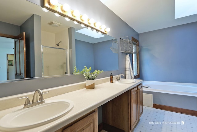 full bathroom featuring a shower stall, tile patterned floors, a garden tub, and double vanity