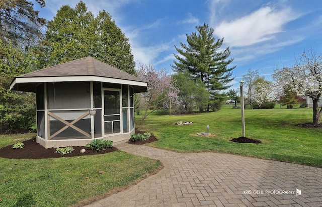 view of green lawn with an outbuilding