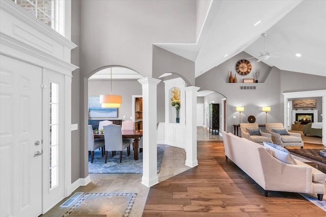 1802 N Concord Ln, Urbana, IL 61802 - entryway featuring visible vents, wood finished floors, a healthy amount of sunlight, high vaulted ceiling, and arched walkways