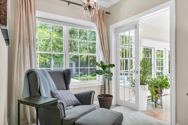 doorway featuring baseboards and a chandelier