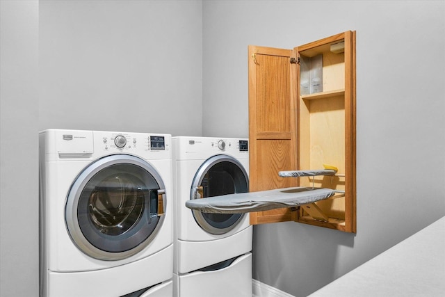 laundry area featuring separate washer and dryer and laundry area