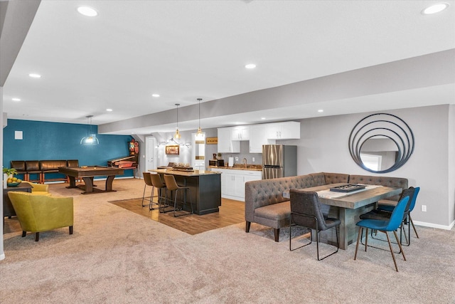 dining room with pool table, recessed lighting, wet bar, and light colored carpet