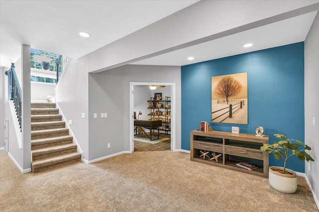 interior space with recessed lighting, carpet floors, baseboards, and stairs
