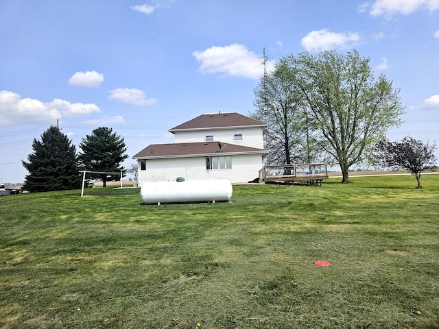 8554 S Daysville Rd, Franklin Grove, IL 61031 - back of house featuring a deck and a yard