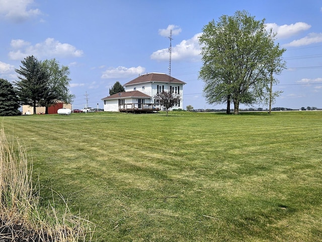 8554 S Daysville Rd, Franklin Grove, IL 61031 - view of green lawn with a deck