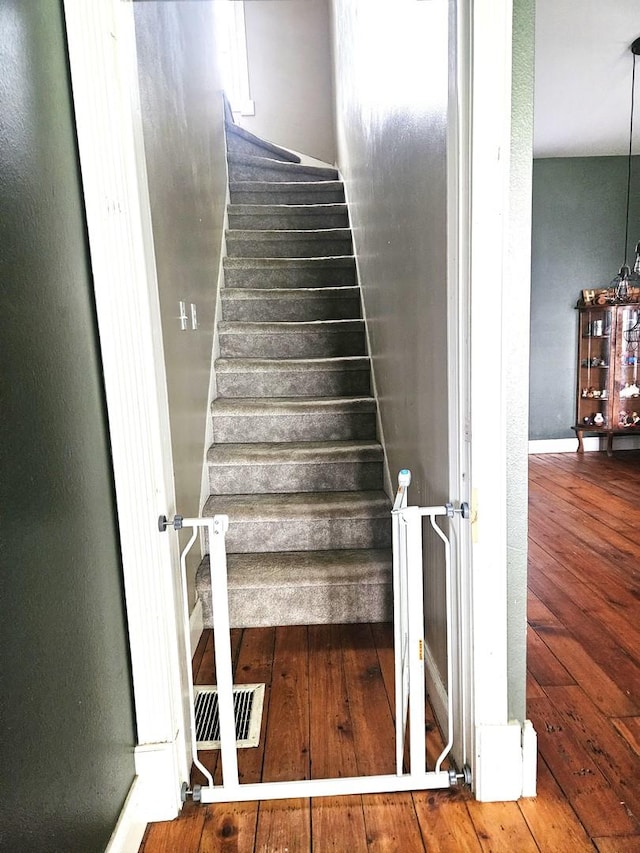 8554 S Daysville Rd, Franklin Grove, IL 61031 - stairway featuring wood-type flooring and baseboards