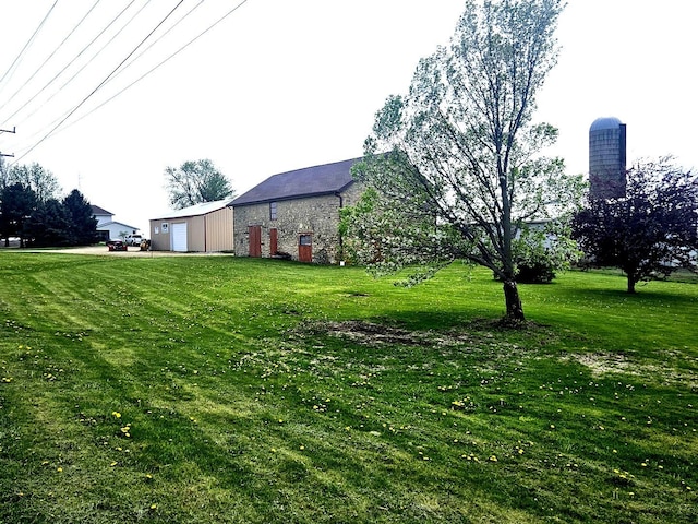 8554 S Daysville Rd, Franklin Grove, IL 61031 - view of grassy yard with an outdoor structure