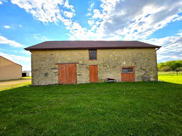 8554 S Daysville Rd, Franklin Grove, IL 61031 - back of property with stone siding and a yard