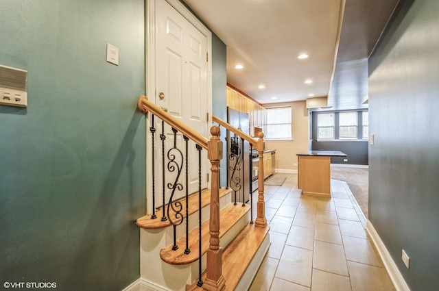 stairs featuring recessed lighting, baseboards, and tile patterned flooring