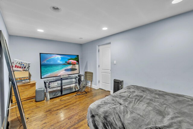 bedroom featuring recessed lighting and wood finished floors