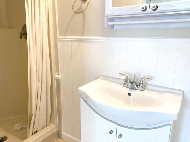 1403 E Le Fevre Rd, Sterling, IL 61081 - bathroom with a shower stall, vanity, and a decorative wall