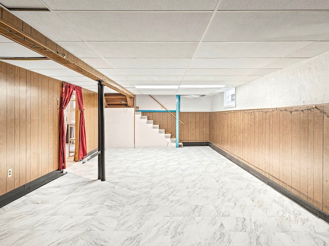 14216 S Normal Ave, Riverdale, IL 60827 - basement featuring wooden walls, baseboards, a drop ceiling, and stairs