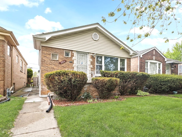 14216 S Normal Ave, Riverdale, IL 60827 - view of front of property featuring brick siding and a front yard