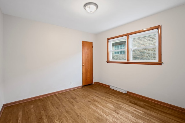 14216 S Normal Ave, Riverdale, IL 60827 - spare room featuring baseboards, light wood finished floors, and visible vents