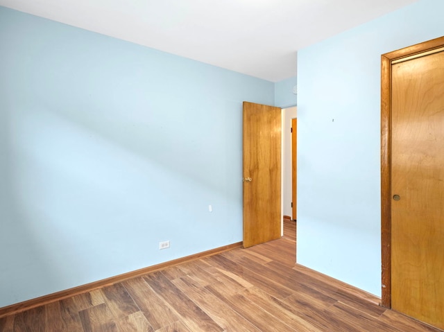 14216 S Normal Ave, Riverdale, IL 60827 - empty room featuring baseboards and wood finished floors