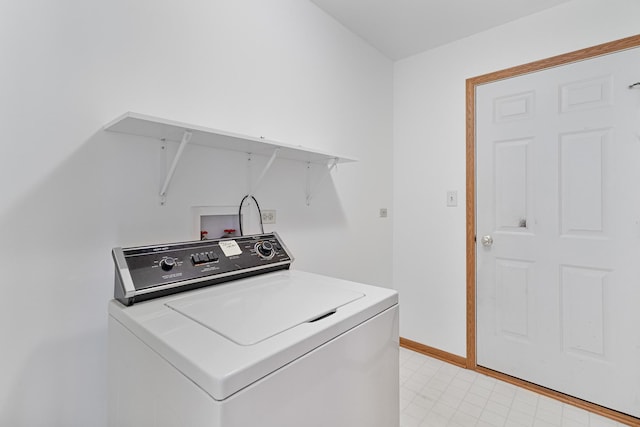 laundry area with laundry area, baseboards, and washer / dryer