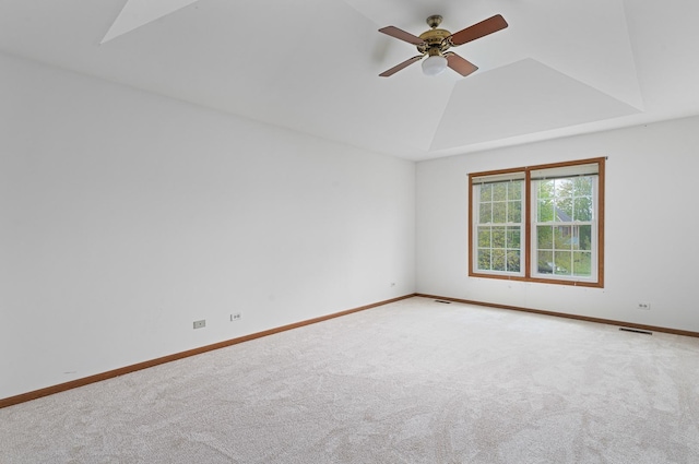 spare room with carpet flooring, visible vents, baseboards, and ceiling fan