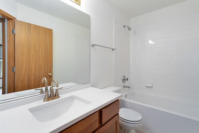 bathroom featuring toilet, vanity, and tub / shower combination