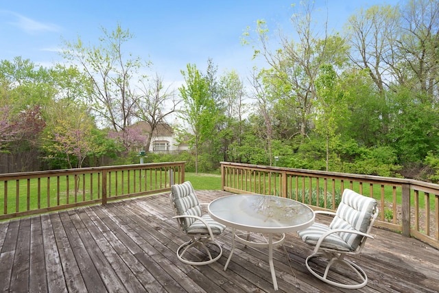 wooden terrace with a yard