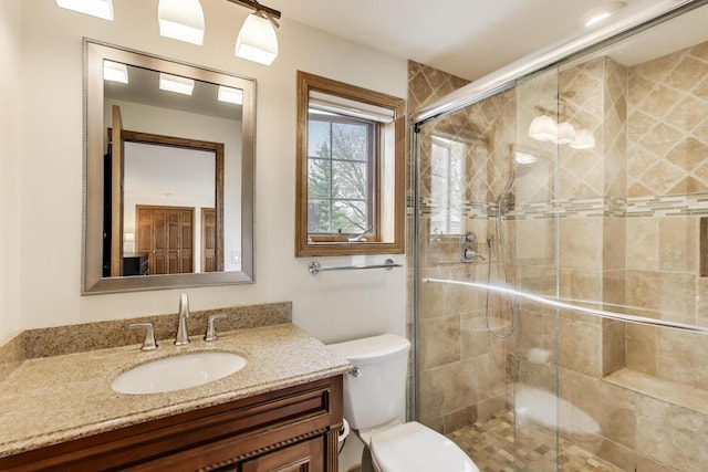 1608 N Douglas Ave, Arlington Heights, IL 60004 - bathroom featuring toilet, vanity, and a stall shower