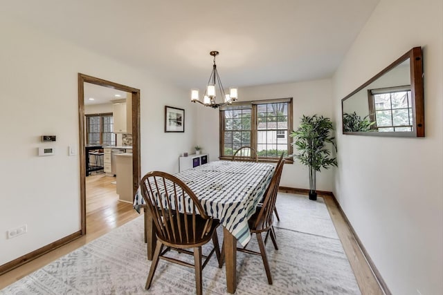 1608 N Douglas Ave, Arlington Heights, IL 60004 - dining room with a chandelier, light wood-style flooring, and baseboards