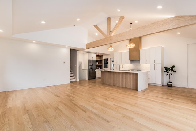 1528 S Ashland Ave, Park Ridge, IL 60068 - kitchen featuring black fridge, a sink, a kitchen island with sink, high vaulted ceiling, and open floor plan