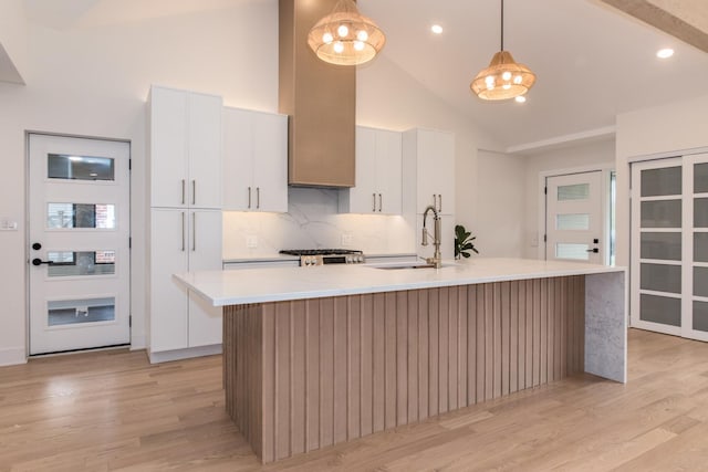 1528 S Ashland Ave, Park Ridge, IL 60068 - kitchen featuring high vaulted ceiling, light wood-type flooring, light countertops, a sink, and range