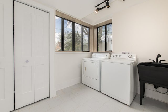 1528 S Ashland Ave, Park Ridge, IL 60068 - clothes washing area featuring laundry area, washer and clothes dryer, baseboards, and a sink