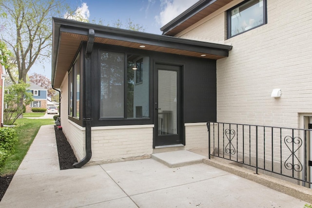 1528 S Ashland Ave, Park Ridge, IL 60068 - property entrance with brick siding, fence, and a patio