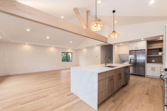 1528 S Ashland Ave, Park Ridge, IL 60068 - kitchen with a kitchen island with sink, appliances with stainless steel finishes, open shelves, a sink, and light wood-style floors